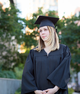 Portrait of female college student on campus in graduation day,