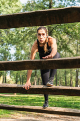 Female athlete on a obstacle course