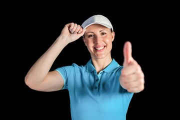 Naklejka premium Sportswoman posing on black background