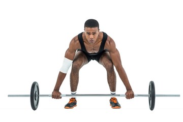 Bodybuilder lifting heavy barbell weights