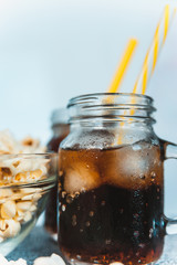 misted bottles of Cola with ice and fresh kettle corn