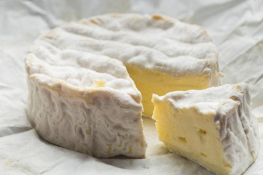 Cheese assorted on a table background. Variety sorts for appetizing, gourmet, delicious snacks. Traditional French dish for wine on lunch and dinner closeup. Camembert, Roquefort.