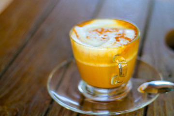 coffee cup above wood table