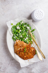 Chicken or pork schnitzel with cheese and  peas salad