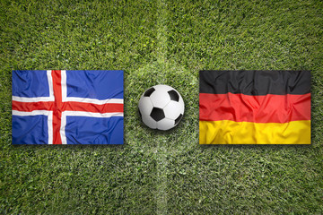 Iceland vs. Germany flags on soccer field