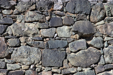 Old rough stone wall background