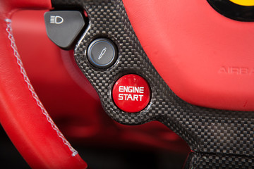 Red supercar steering wheel detail 
