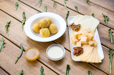 Cheese snacks on the wooden table