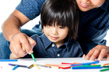 Asian kid learning to draw.