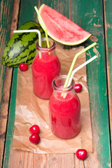 Fresh watermelon juice on a wooden background