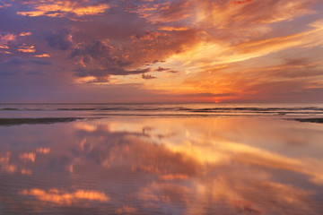 Sunset reflections on the beach, Texel island, The Netherlands