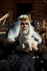 Old druid sits in chair