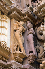 Fototapeta premium Erotic sculpture of lovers at famous ancient temple in Khajuraho, India