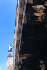 Fototapeta na wymiar A look at the bottom of the sculpture of the Charles Bridge in P