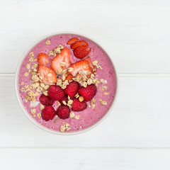 Healthy Pink Smoothie in the Bowl from Banana and Strawberries w