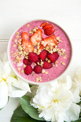 Healthy Pink Smoothie in the Bowl from Banana and Strawberries w