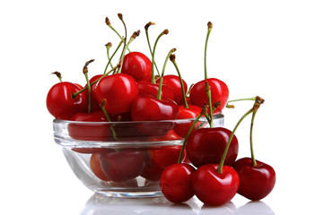 delicious bunch of cherries in glass bowl on a white isolated background with reflection