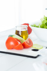 Cutting vegetables to prepare a healthy fresh salad