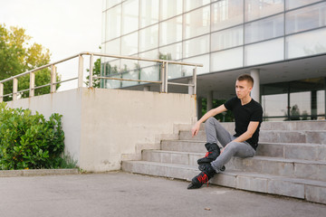 Rollerblader sitting outdoor