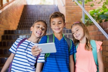 School kids taking selfie from mobile phone