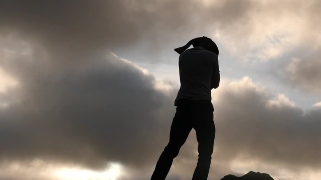 Silhouette of man fast clothe oneself sky background 