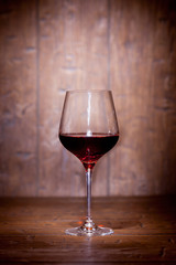 Wine glass on wooden background