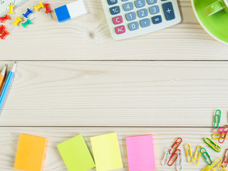 Colorful stationery coffee cup on the wooden table