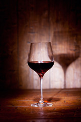 Wine glass on wooden background