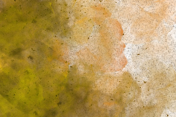 Abstract colourful watercolour background in shades of orange an