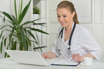 Female doctor with laptop