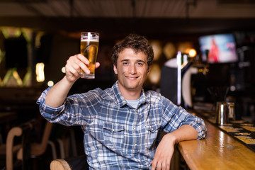 single man sitting at bar having a beer