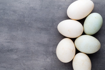  Duck eggs on a cage gray background.