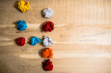 figure 4 is laid out on a wooden table creasy of colored paper