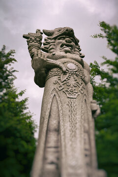 Granite statue of Radegast, Radhost hill / Pustevny mountain saddle, Beskids mountains, Czech republic / Czechia - mythological west slavic god of hospitality, abundance, war and victory