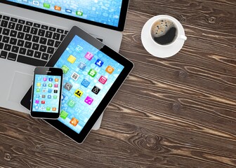 Laptop, phone, tablet pc and coffee. 3d rendering.