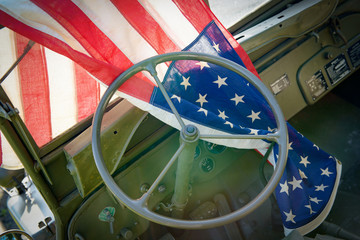 ww2 military vehicle with American flag