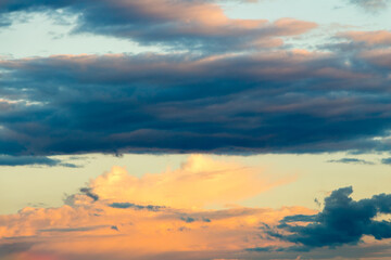 Beautiful cloudy sky with sun rays. Cloudy abstract background. Sunset light.