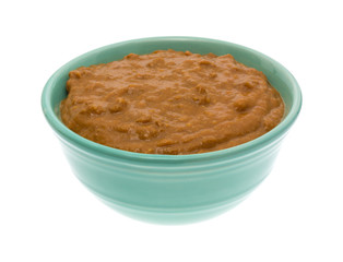 Bowl of no bean chili isolated on a white background side view.