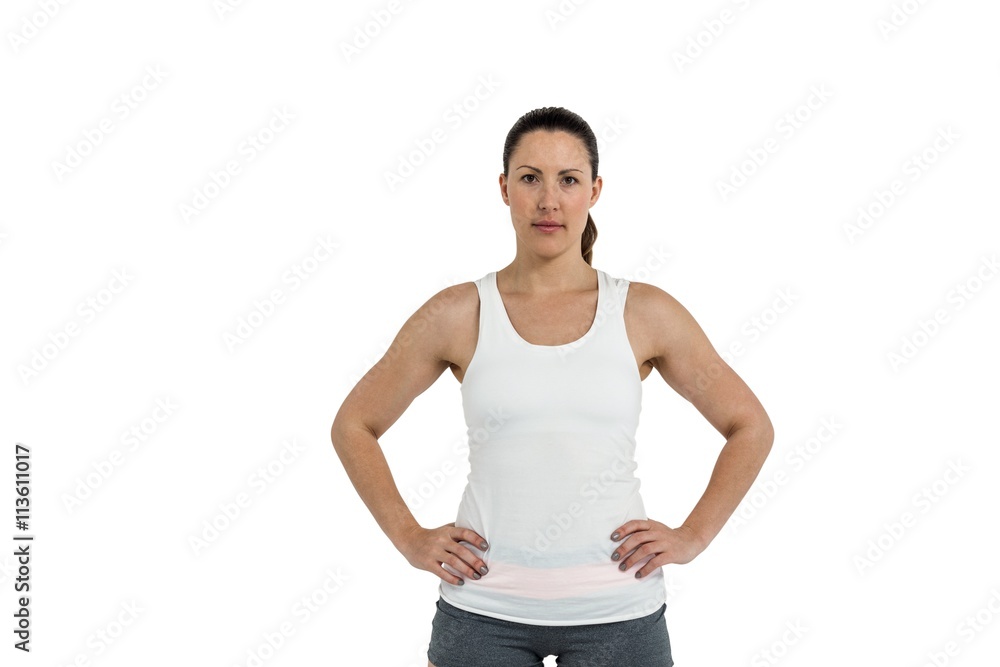 Wall mural portrait of female athlete standing with hands on hips