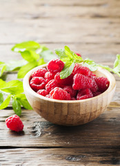 Fresh sweet raspberry on the wooden table