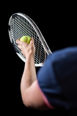 Tennis player holding a racquet ready to serve 
