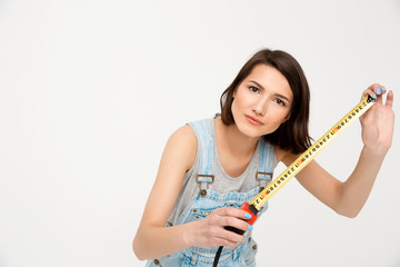 portrait of young beautiful girl, holding tape measure