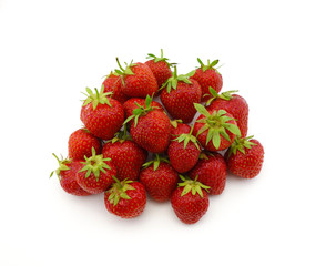 large fresh red strawberries in a pile on a white background