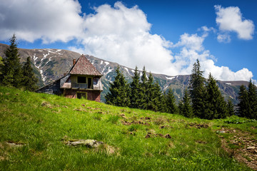 Fototapeta na wymiar Beautiful landscape with old, refuge house in the Carpathian mou