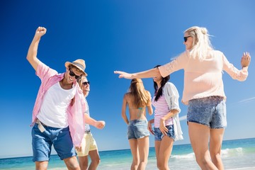  Friends  dancing on the beach