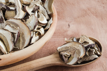 Dried porcini mushrooms on a wooden table. Rustic style.