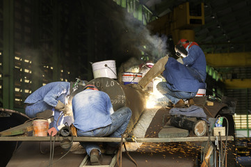 construction welder welding steel on site