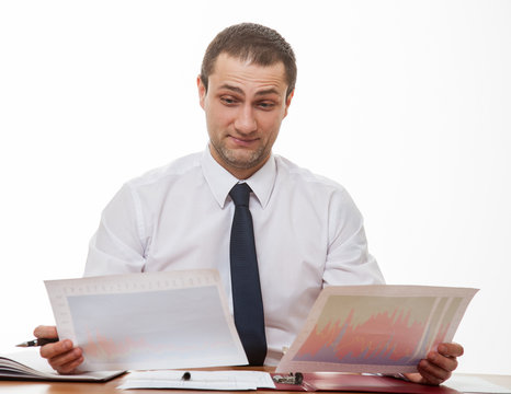 Young Businessman Comparing Documents