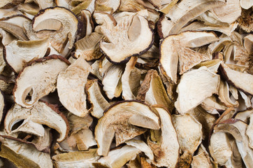 Dried porcini mushrooms on a wooden table. Food background.