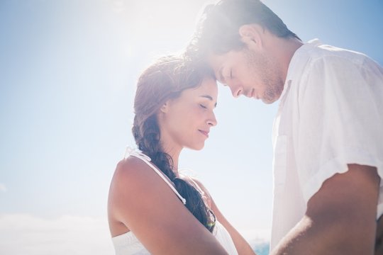  Happy couple embracing on the beach